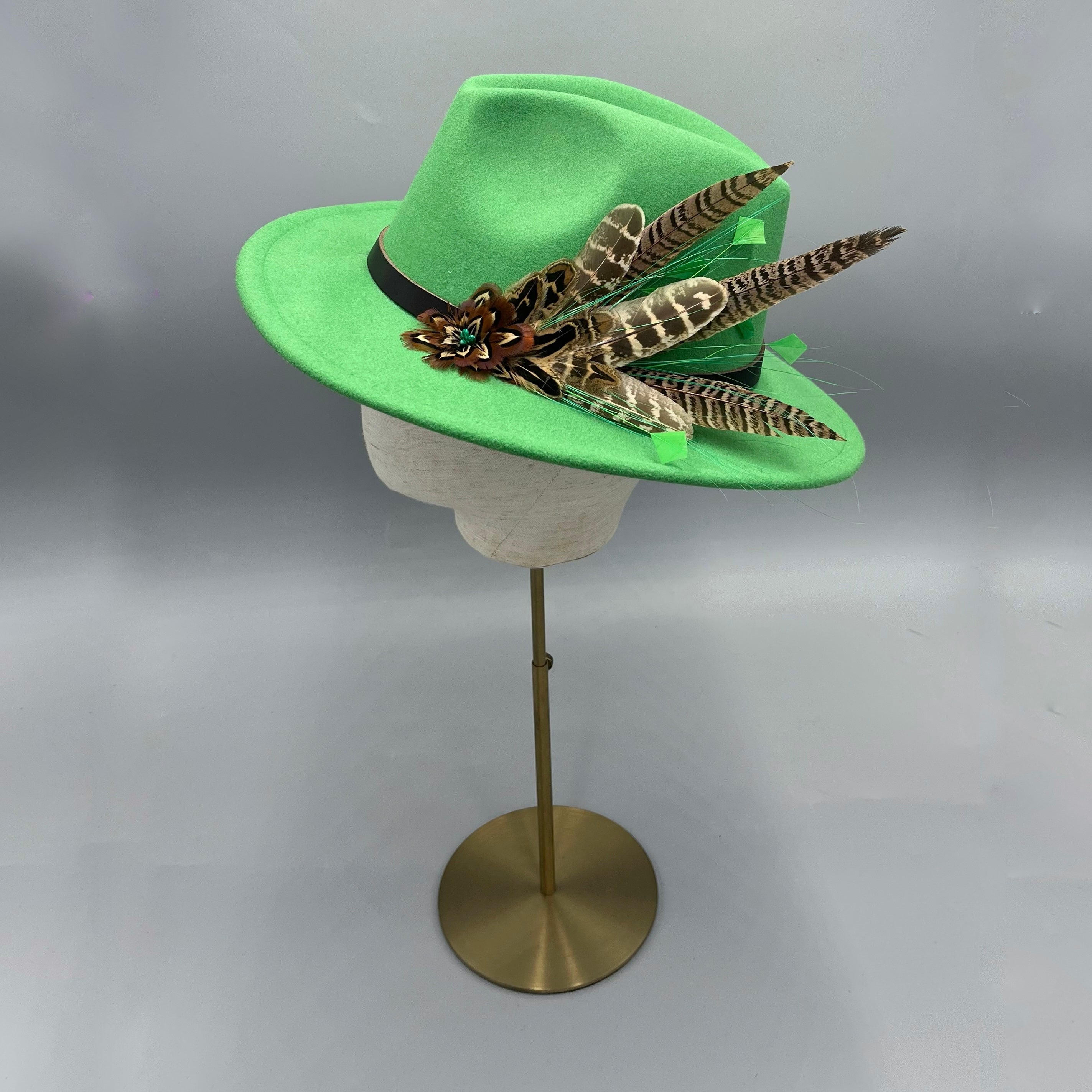 Emerald green fedora hat with pheasant feathers