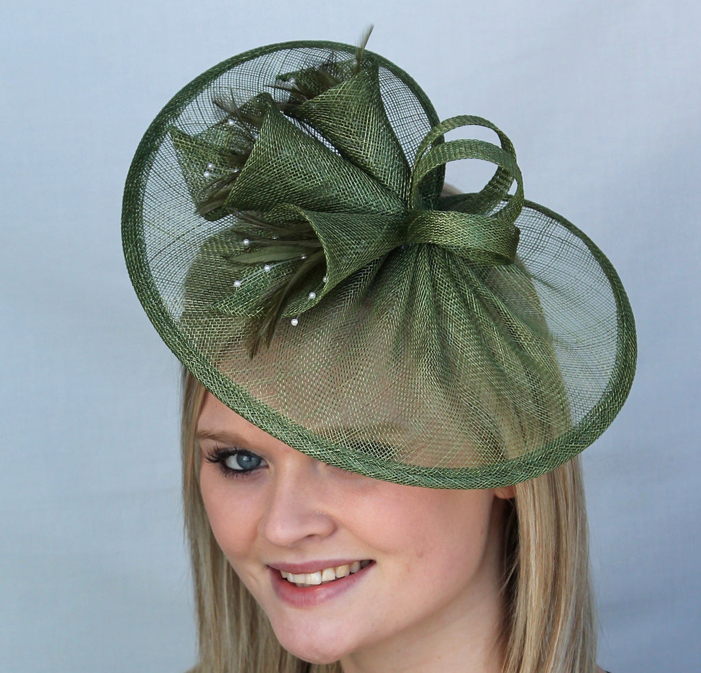 dark green sinamay fascinator, trimmed with sinamay lillies. Perfect for a wedding