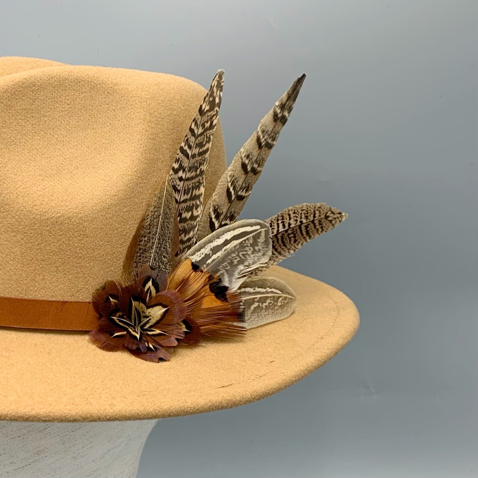 Camel fedora hand embellished with natural game bird feathers